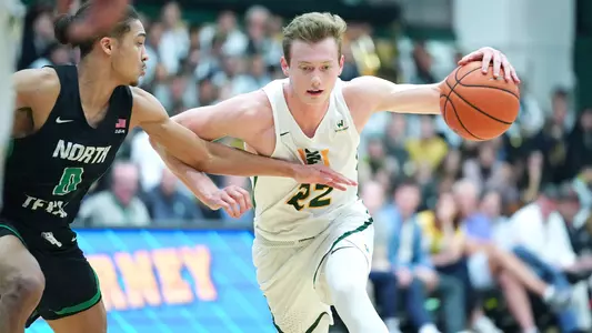 Chase-Foster-USF-Dons-Mens-Basketball-dribble-North-Texas