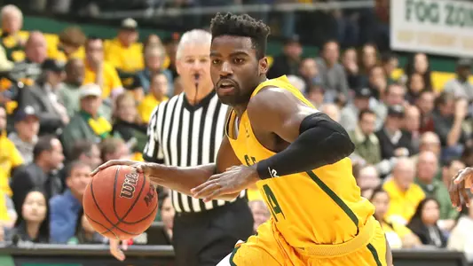 Charles-Minlend-USF-Dons-Mens-Basketball-dribble