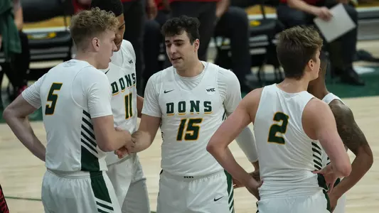 Huddle around Gabe Stefanini MBB vs. UNLV