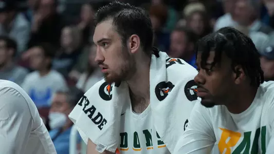 Vova on bench in 2022 WCC Tournament