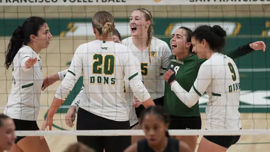 VB celebration huddle vs. LMU