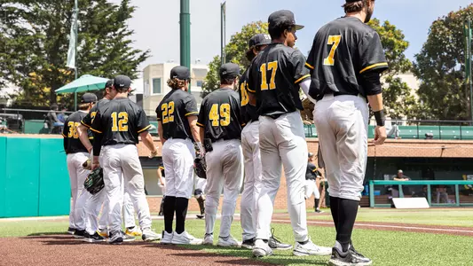Baseball lining up for the anthem vs. Pacific