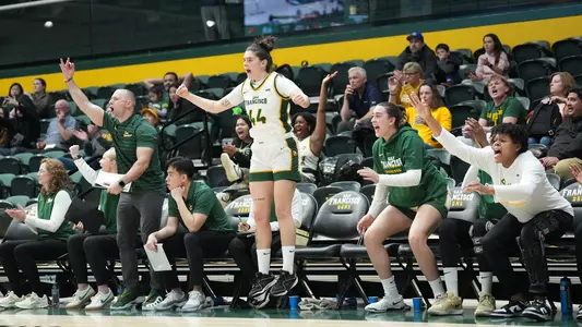 Mia Vuksic celebrating on the bench