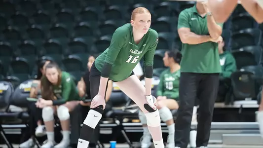 Maeve Bailey waiting for a serve vs. SCU