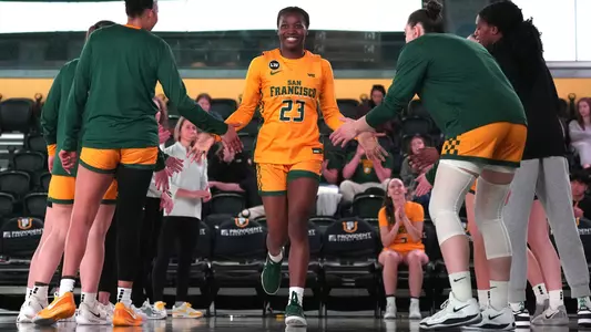 Candy Edokpaigbe High-Fiving Teammates Pre Game vs. CSUMB