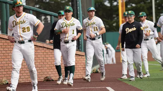 Baseball players running to the dugout 2025