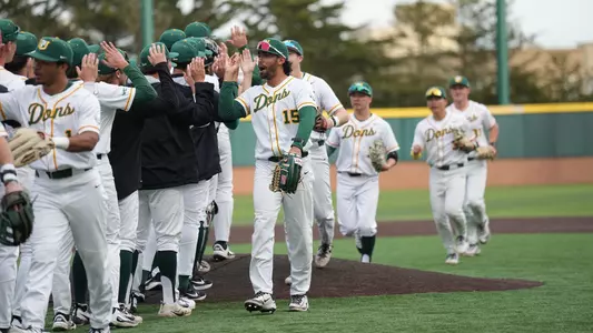 Baseball high fives after win vs. Sac State