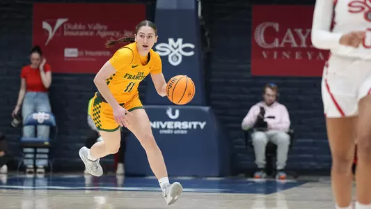 Ziaka bringing the ball up the court at SMC