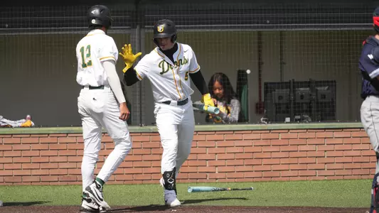 Eddison Esquivel celebrating with TJ Rogers vs. Saint Mary's