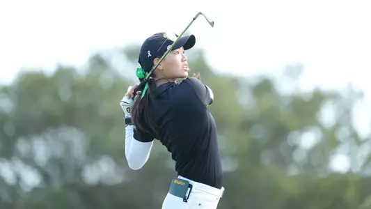 Riana Mission swinging at Juli Inkster