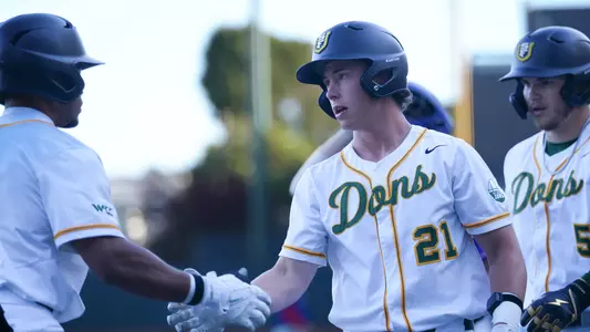 Tino Vasell high fiving Jordan Lewis vs. UML 2026