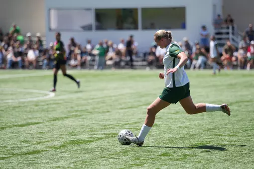 #4 Women's soccer dribbling the ball