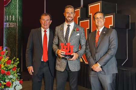 Crimson Club Board President Drew Hall (left), Alex Smith (center) and Athletics Director Mark Harlan (right).