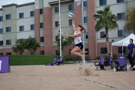 Beach player Sage Patchell serving