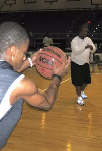 UT Arlington assistant men's basketball coach Derrick Daniels delivers a pass during practice.
