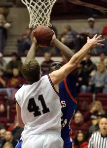 Anthony Vereen goes up for a basket over Montana's Brian Qvale in the Mavs 67-65 loss to the Grizzlies.