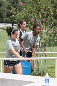 Members of the UTA volleyball team assisted students move into their dorms at Kalpana Chawla Hall.