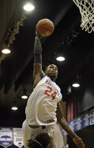 Kevin Butler skies for a dunk in Monday night's season opener against East Texas Baptist. He finished with nine points and nine rebounds.