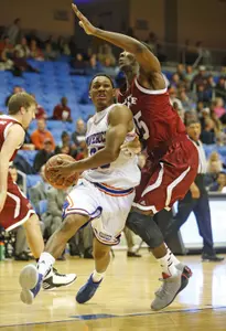 Cameron Catlett drives to the basket in Saturday's win over NMSU.