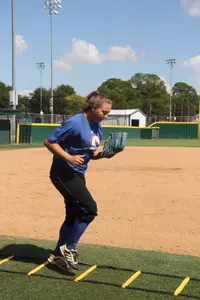 Junior Meagan Michele works on her quickness during the ladder drill.