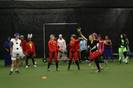 Britnea Barilli as the Queen of Hearts catches the ball in over the line.