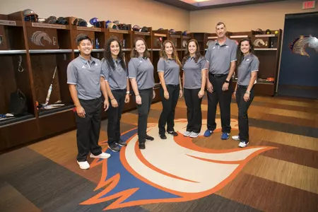 athletic training staff with roy and gina
