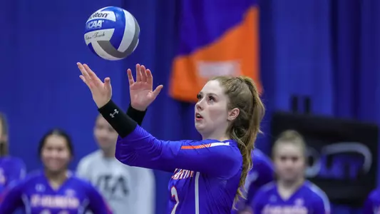 Mollie Blank prepares to serve.