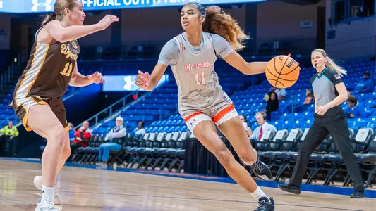 Kira Reynolds Driving Against Wyoming Defender