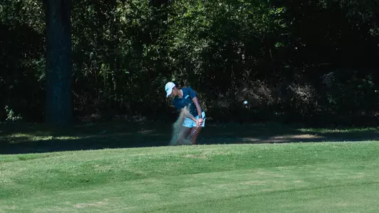 Womens Golfer Swinging