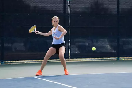 Elizaveta Mladentseva prepares to hit a tennis ball