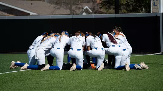 team kneeling