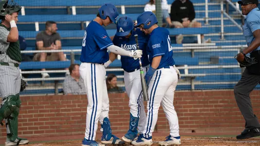 Team celebrating Melendez Home Run