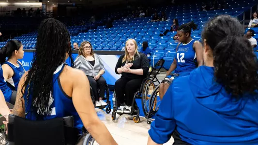 Morgan Wood Speaks to a huddle