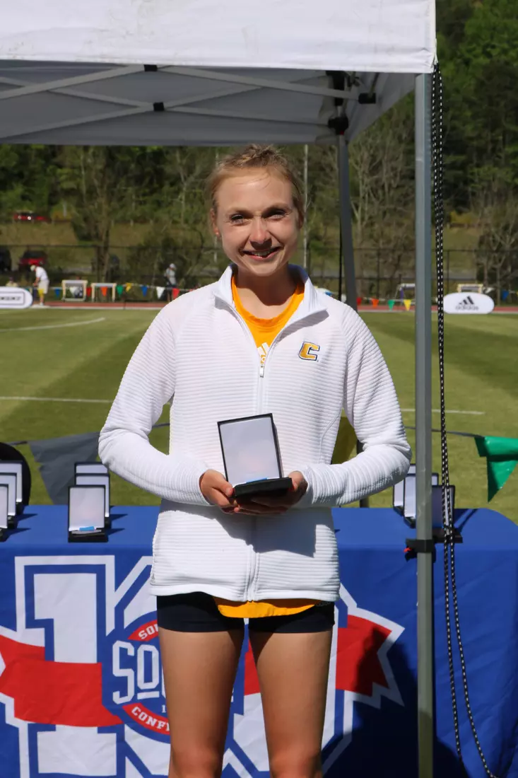 Lesley Green receives her medal for third in the 10K