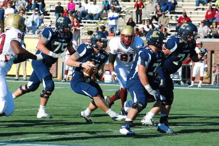 Tull and Huesman Set Records in 24-17 Mocs Win