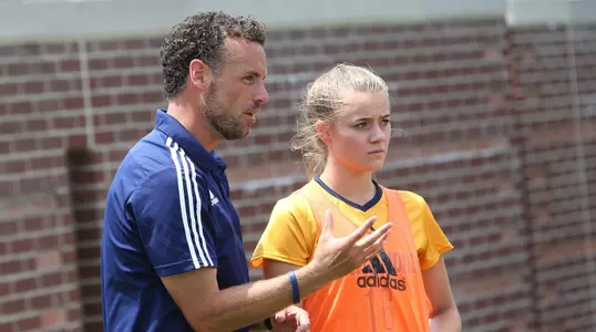 Coach MicKinney with Rachel Lindsey