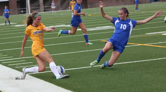 Samantha Hogan gets past the defender