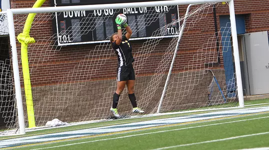 Melia Correa stretches for the save