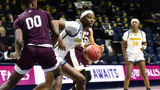 Eboni Williams drives around her defender.