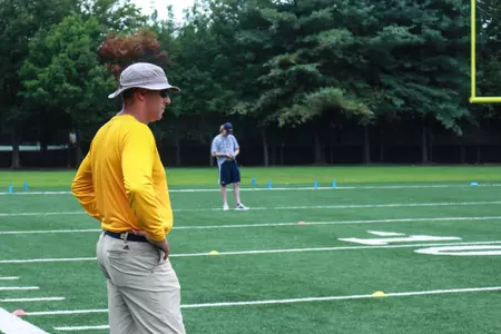 Coach watched running