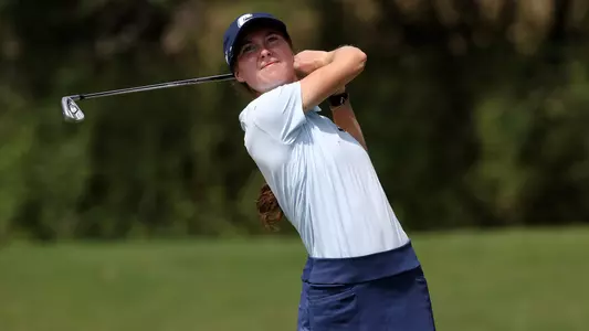 Esme Hamilton follows her shot as it heads to the green.