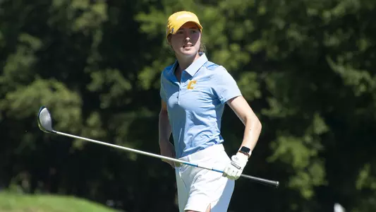 Esme Hamilton stares down her drive as she walks back to her bag.