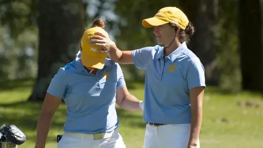 Colette Murray shares a light moment with Beatriz Barrios after Barrios sticks it close at Vandy.