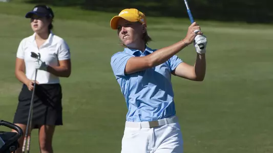 Dorota Zalewska poses in perfect form watching her approach to the green.