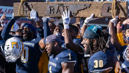 The Mocs hoist the Rail Rivalry trophy again in 2021.