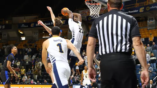 Silvio DeSousa mercilessly attacks the rim with the first of three first half dunks against UNC Asheville.