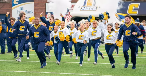 Spirit Squad Leading Team onto the Field