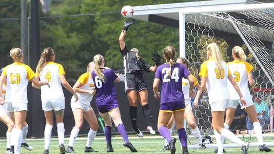 Ashton Shields punches the soccer ball away