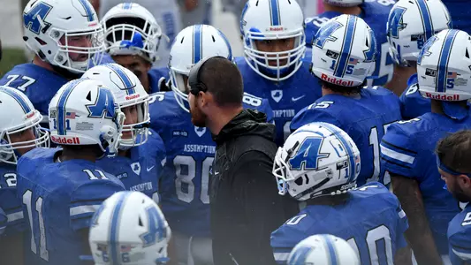 Tommy Galt talks with his offense at Assumption.