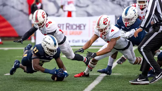 Jerrell Lawson and Rashun Freeman combine on a takeaway at WKU.